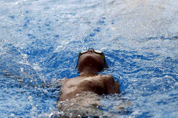 Dublin Atlantic's Jake Wadsworth competes in the age 9-10, 25-meter backstroke during the NEW League Championships  at Dublin Community Pool North.  (Shane Flanigan / ThisWeek Community News)